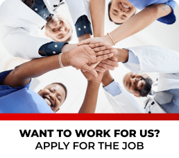 Group of medical professionals stacking hands in teamwork